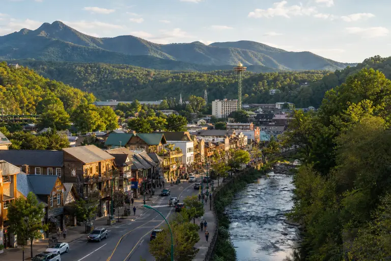 Photoreal editorial image for How to Do Gatlinburg Without Letting the Parkway Run the Whole Trip, inspired by Gatlinburg