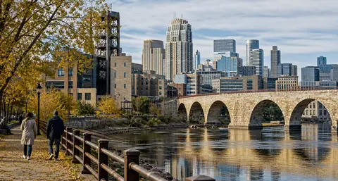 Photoreal Minneapolis riverfront skyline near Stone Arch Bridge