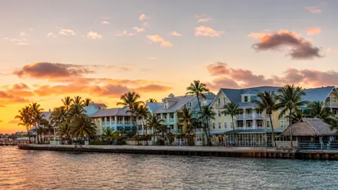 Photoreal editorial image for Should You Stay Near Duval Street or Somewhere Quieter in Key West?, inspired by Key West