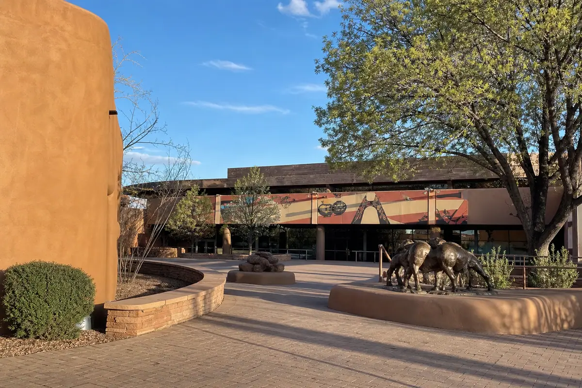 Photoreal travel-editorial view of Indian Pueblo Cultural Center in Albuquerque, New Mexico