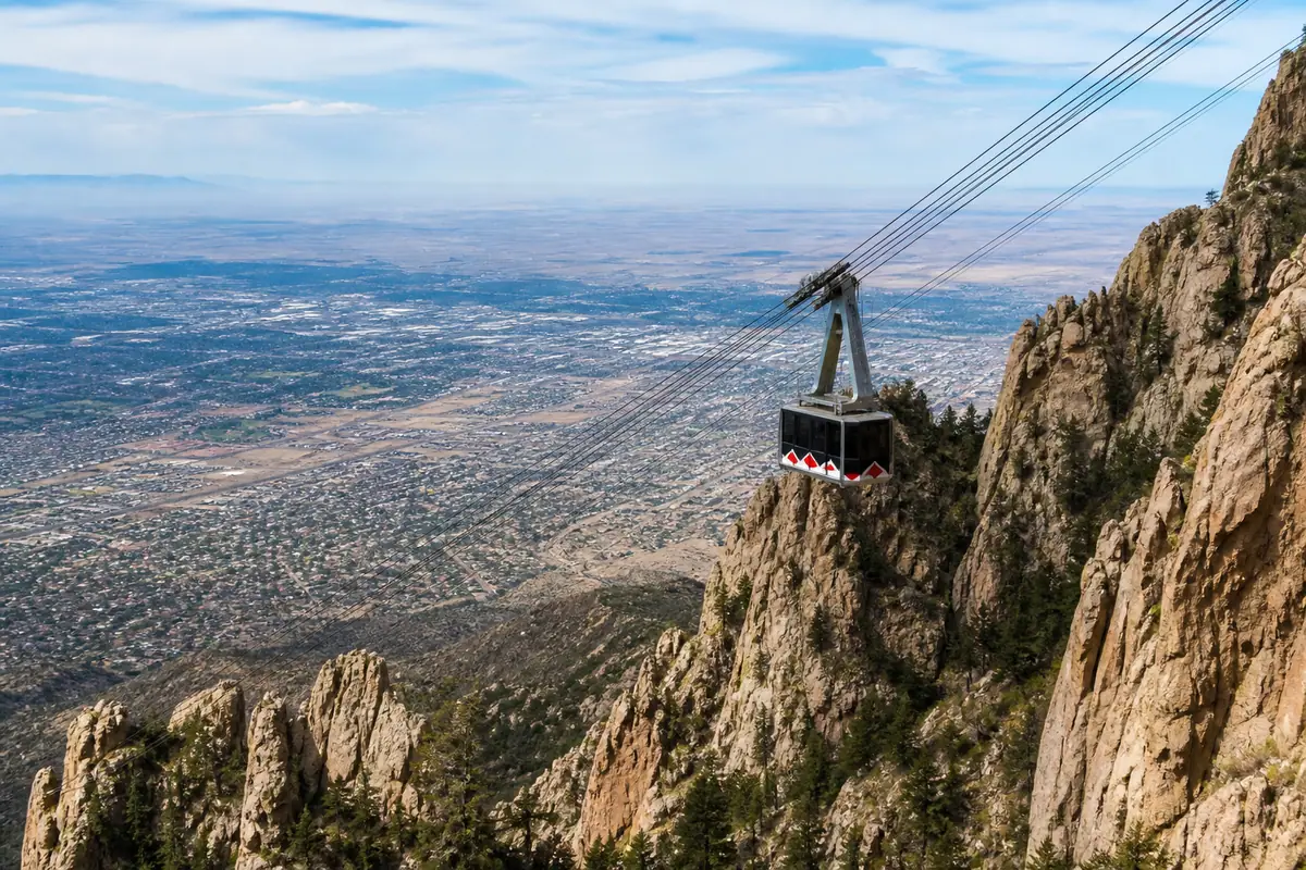 Photoreal travel-editorial view of Sandia Peak Tramway in Albuquerque, New Mexico