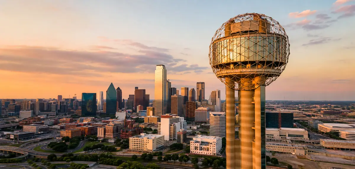 Photoreal contemporary Dallas downtown hotel facade in early evening