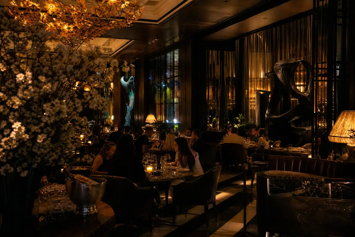 Photoreal classic Dallas steakhouse dining room with rich wood and evening glow
