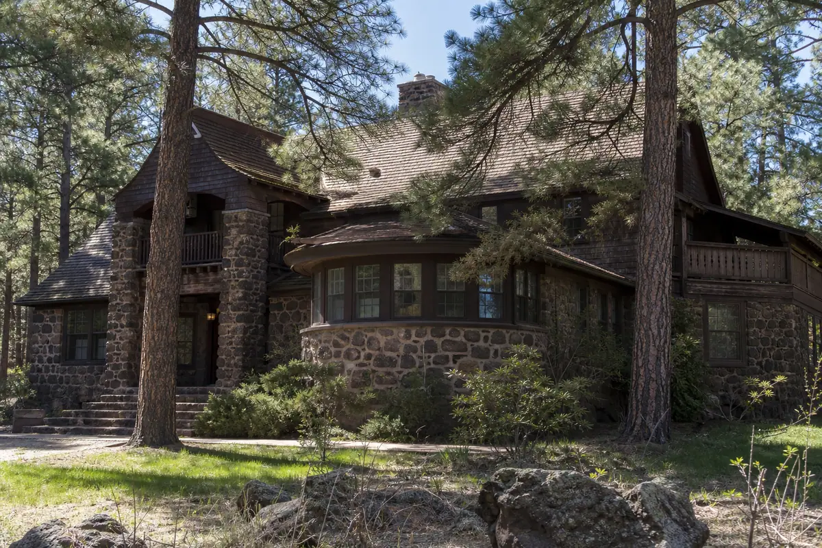 Photoreal travel-editorial view of Riordan Mansion State Historic Park in Flagstaff, Arizona