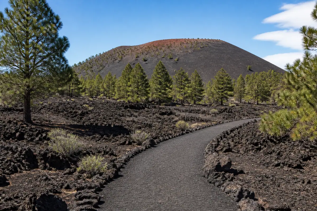 Photoreal travel-editorial view of Sunset Crater Volcano National Monument in Flagstaff, Arizona