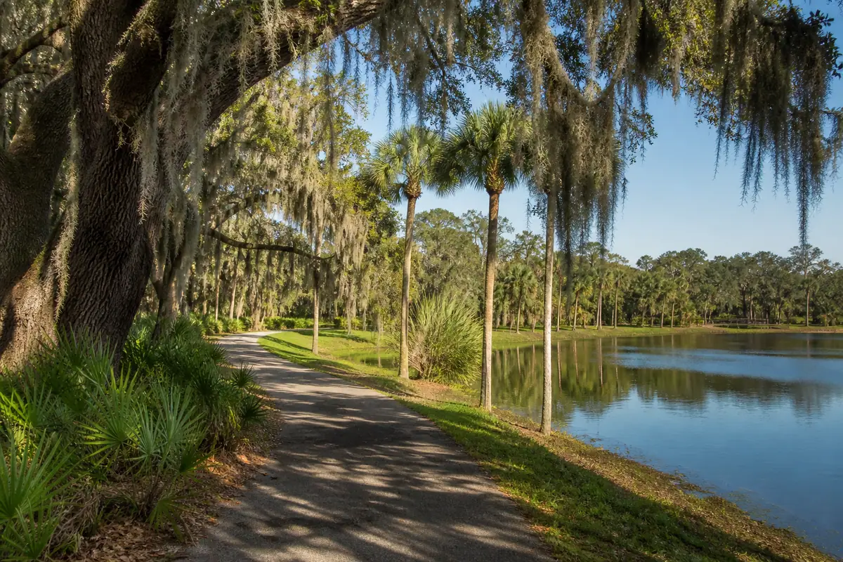 Photoreal travel-editorial view of Lakes Regional Park in Fort Myers, Florida