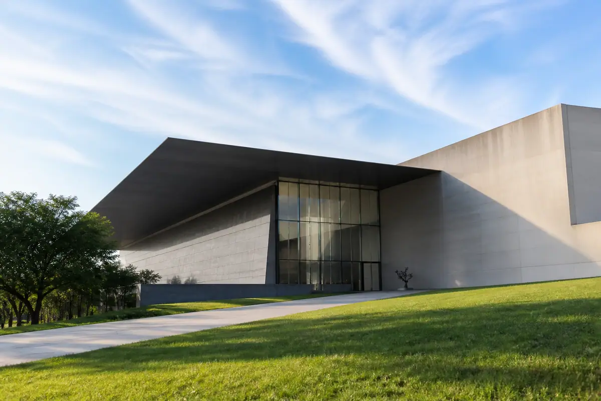 Photoreal travel-editorial view of Kemper Museum of Contemporary Art in Kansas City, Missouri