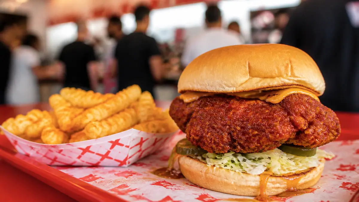 Photoreal hot chicken sandwich at Howlin' Ray's in Los Angeles