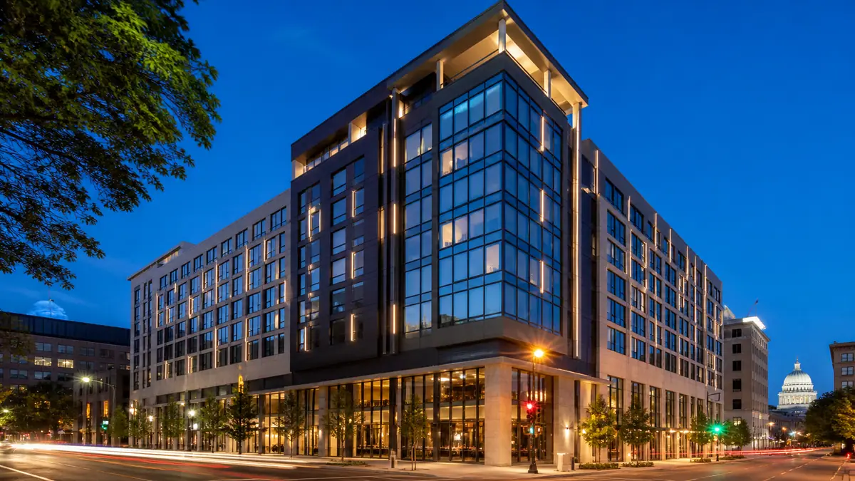 Photoreal travel-editorial view of AC Hotel Madison Downtown in Madison, Wisconsin