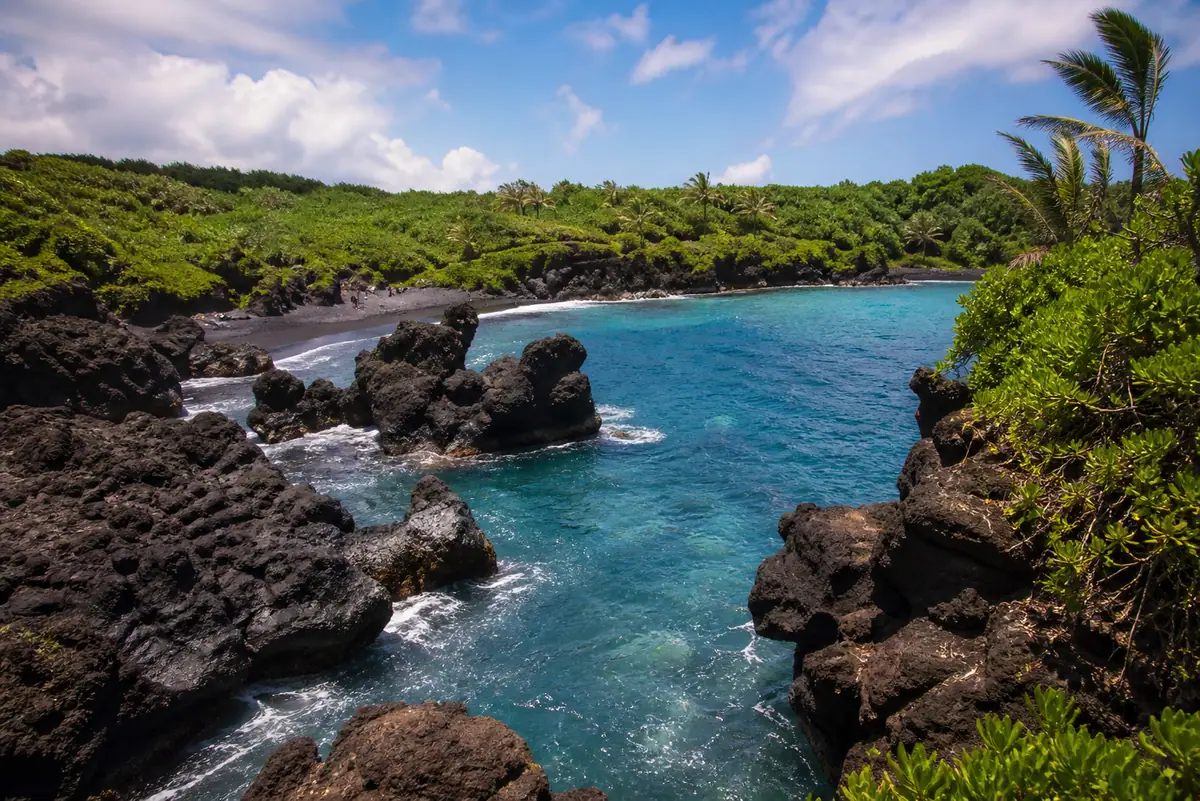 Photoreal black-sand cove at Waiʻānapanapa State Park on Maui