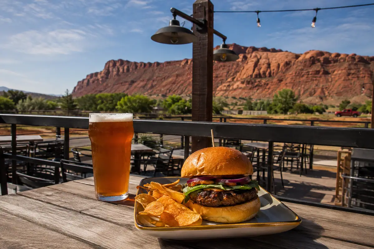 Photoreal travel-editorial view of Moab Brewery in Moab, Utah
