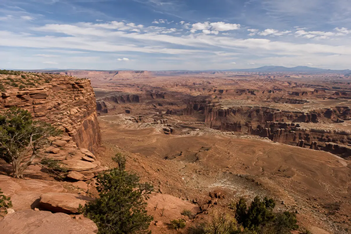 Photoreal travel-editorial view of Island in the Sky Scenic Drive in Moab, Utah