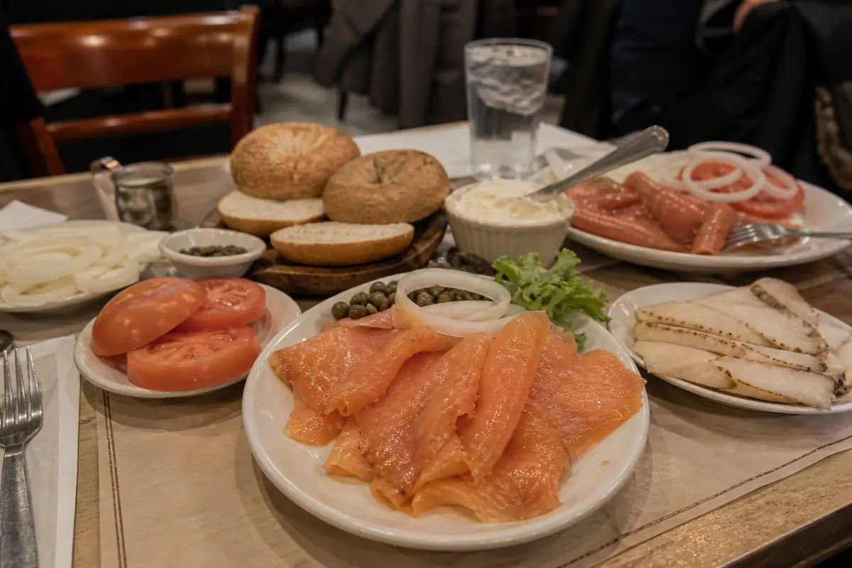 Photoreal smoked fish brunch spread at Barney Greengrass in New York City