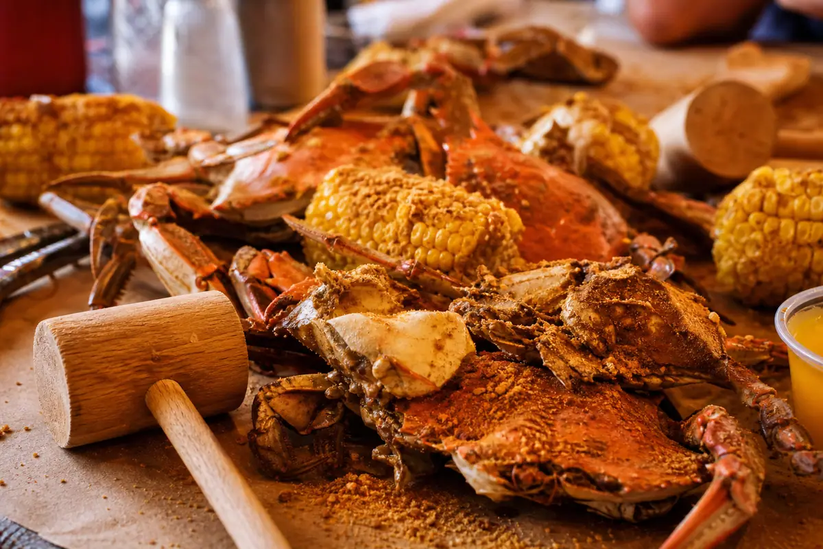 Photoreal steamed crab table spread representing Crab Bag in Ocean City