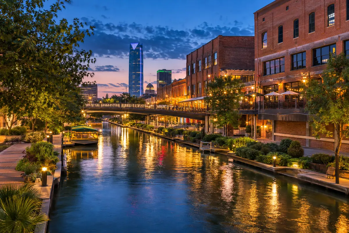 Photoreal travel-editorial view of Bricktown Canal and Water Taxi in Oklahoma City, Oklahoma