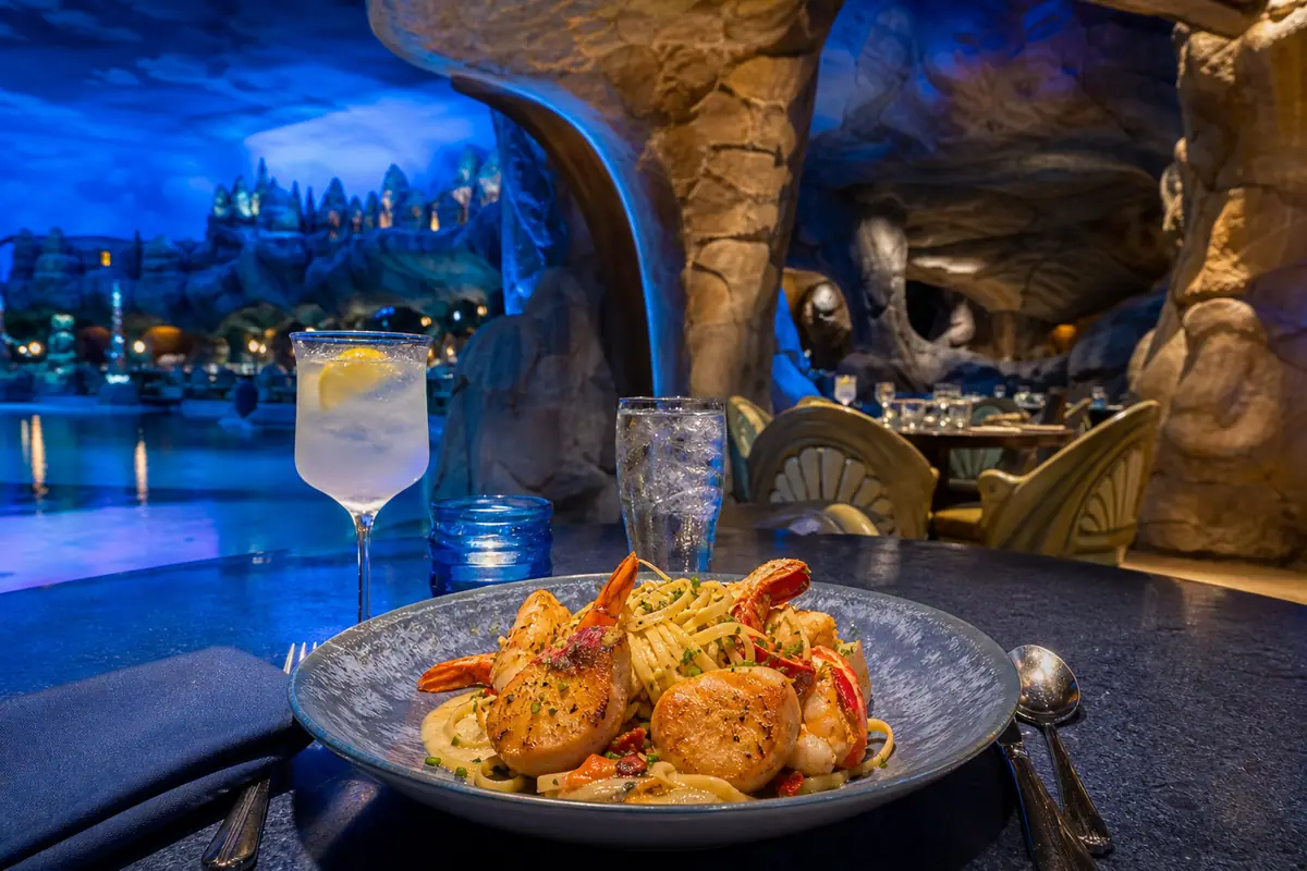 Photoreal upscale seafood pasta inside Mythos Restaurant at Islands of Adventure