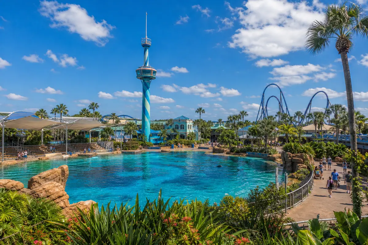 Photoreal SeaWorld Orlando lagoon and coaster skyline in bright Florida daylight