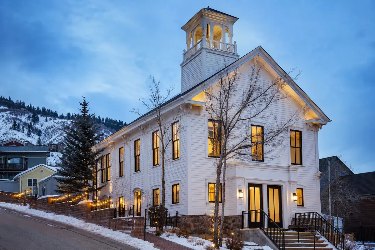 Photorealistic travel-editorial view of Washington School House Hotel in Park City, Utah