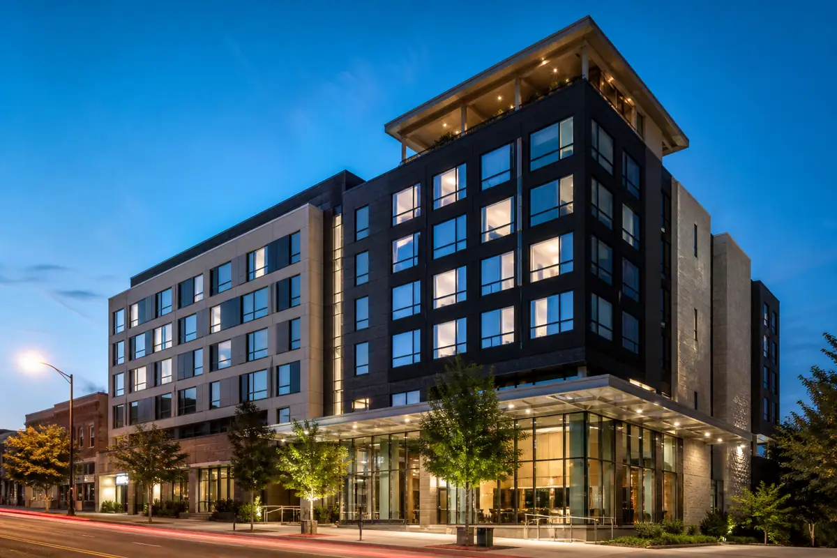 Photorealistic travel-editorial view of AC Hotel Raleigh Downtown in Raleigh, North Carolina