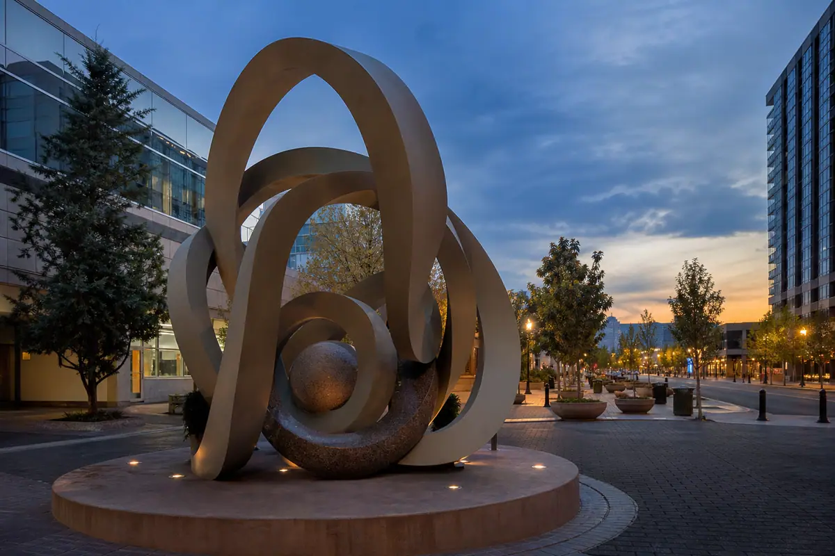 Photorealistic travel-editorial view of Reno Arch and Burning Man Art Walk in Reno, Nevada