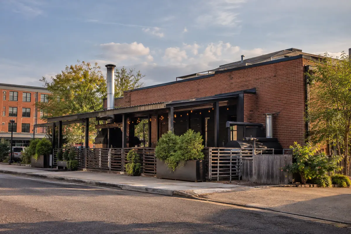 Photoreal travel-editorial view of ZZQ Texas Craft Barbeque in Richmond, Virginia