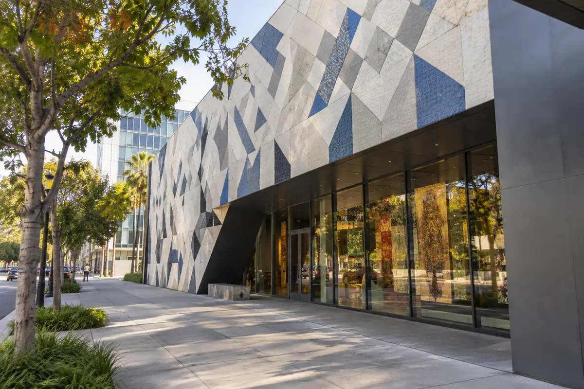 Photoreal travel-editorial view of San José Museum of Quilts & Textiles in San Jose, California