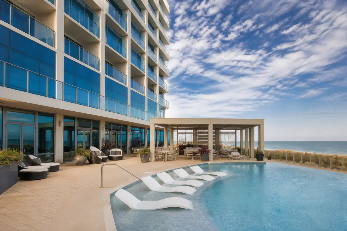 Photoreal travel-editorial view of Hilton Garden Inn Virginia Beach Oceanfront in Virginia Beach, Virginia