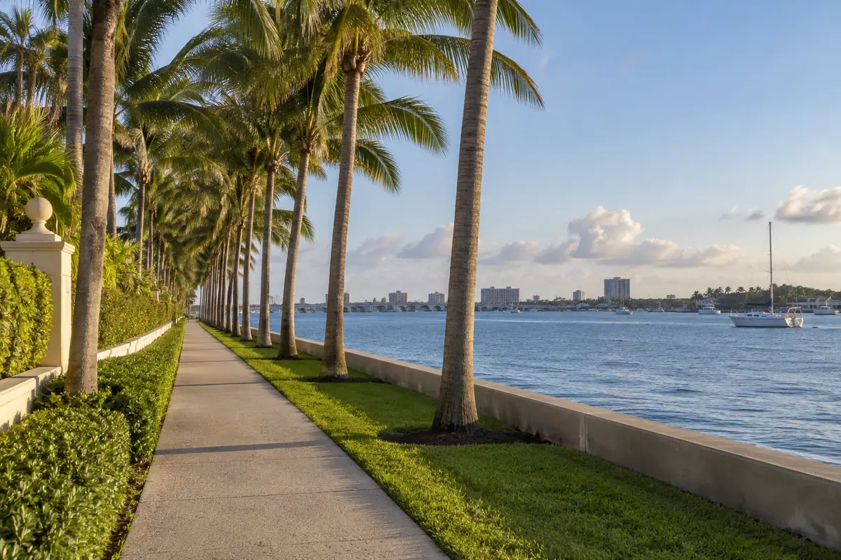 Photoreal travel-editorial view of Palm Beach Lake Trail in West Palm Beach, Florida